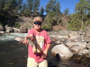 Mac with one of the beautiful fish they pulled out of the confluence of Hellroaring Creek and the Yellowstone River.