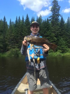 Ben with a big smallmouth from the West Outlet of the Kennebec.