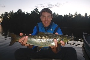 Teddy with a monster of a Landlocked Salmon caught right in front of the campsite we stayed at for four nights. 