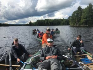 Hitching a ride back to camp after a long paddle down the West Outlet.